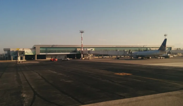Daniel Oduber Quirós airport terminal in Liberia seen from the tarmac at sunset